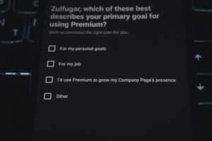A dark screen shows a survey question asking the user to select their primary goal for using Premium—personal goals, job, growing company page presence, Social Media Management, or other. None of the checkboxes are selected.