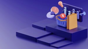 3D illustration of shopping and marketing elements, including a shopping basket, pie chart, target, percentage symbol, shopping bag, and megaphone—ideal for depicting digital marketing or website design concepts—arranged on steps against a blue background.