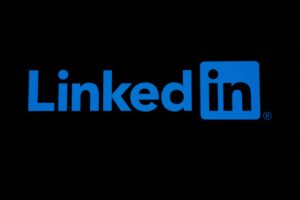 Blue LinkedIn logo with "LinkedIn" text inside a blue square, displayed on a black background—perfect for marketing agency or digital marketing social media management visuals.