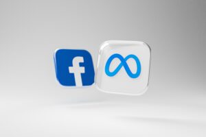 Two floating icons on a light background represent Social Media Management: one features the blue Facebook f logo, and the other displays the blue Meta infinity symbol, perfect for enhancing digital marketing and web site design visuals.